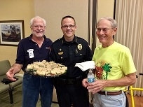 Punta Gorda Police Chief Tom Lewis flanked by TEAM volunteers Bill Welsch (l) and Bob Bechtold.reduced