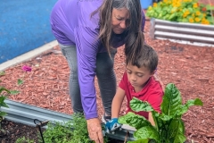 young-boy-with-volunteer-RED