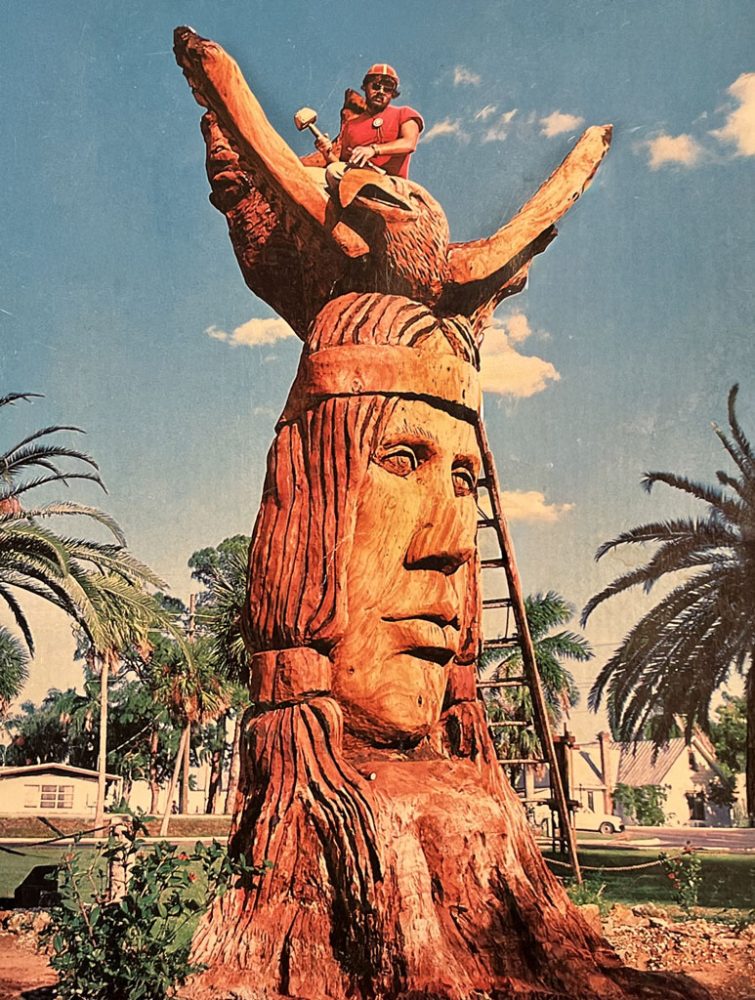 Calostomicu Whisperin Giant statue carving by Peter Toth. Pete Toth sits on top of the statue as he carves it.